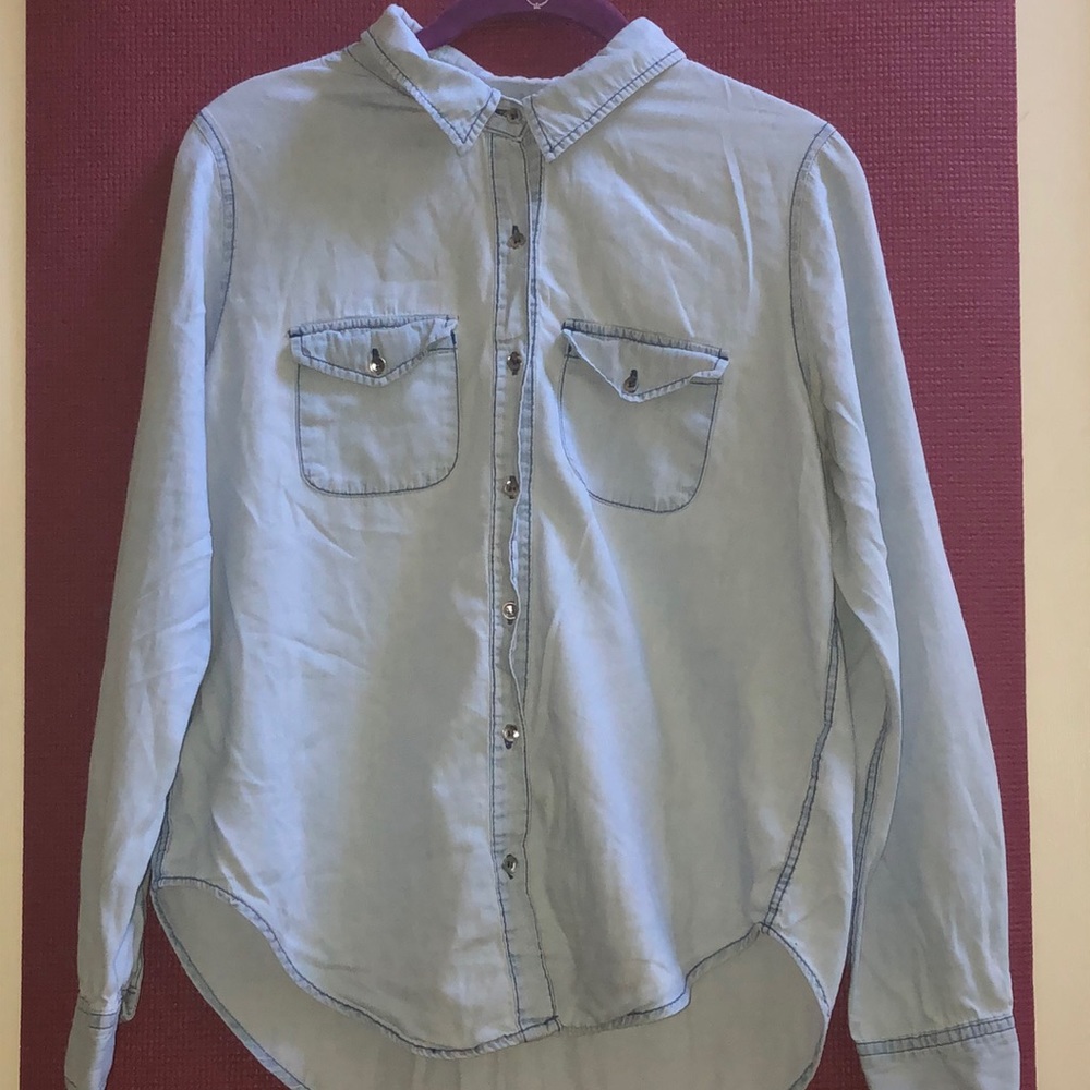 Light-washed blue long-sleeve button down top.